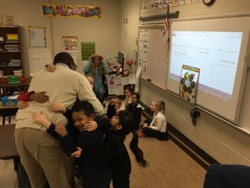 Bilingual education advocate and World Language Academy teacher Jason Mizell is greeted by former students. For more on WLA, see Part Two of this series.