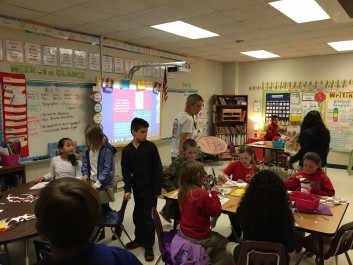 WLA fourth-grade teacher Lane Sharrett gets ready to start a history lesson. She's one of the few teachers in the building who's from the United States and teaches in English.