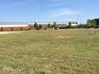 The 38 acres that adjoins the Crossplex in Five Points West is now a grassy field.  If the city of Birmingham and developer Bob Nesbitt have their way, it will become a hub for a hotel, amphitheater and several restaurants and stores.