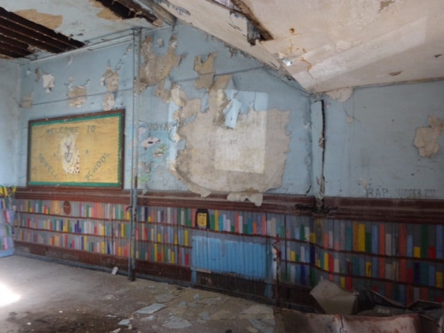 The walls are still painted like bookshelves, an effort by Eva Hardy Jones.
