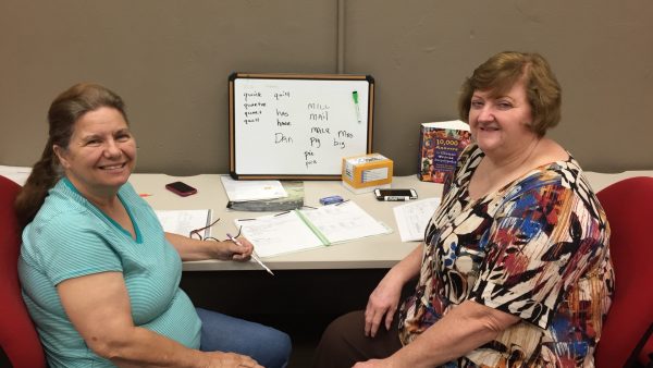 Learner Janie Morgan, left, and volunteer tutor Judy Hickman take a quick break from lessons at the Literacy Council in downtown Birmingham.