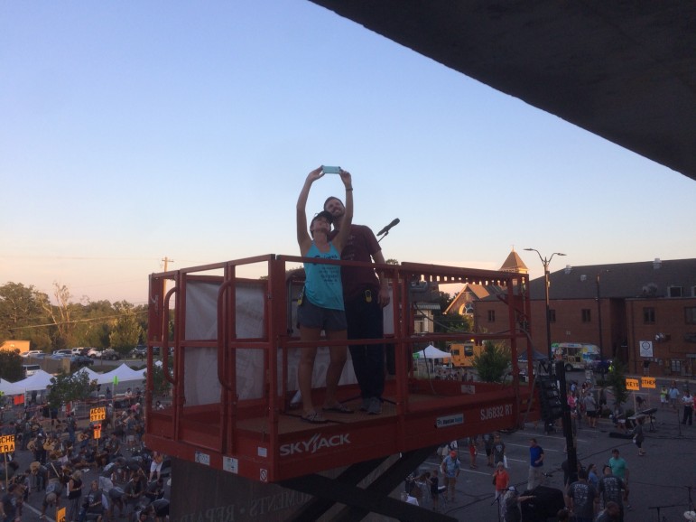 Organizers Tim and Lana Spicer take a selfie after the long, hot day. Tim conducted the group from about three stories up on this scissor lift. 