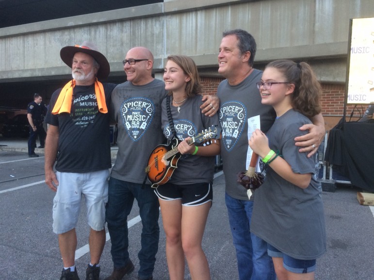 Sister Hazel's Ken Block (second from left) and Drew Copeland (second from right) taking pics with fans.