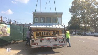 The last section of roof is loaded onto the truck and secured for transport to Denver.