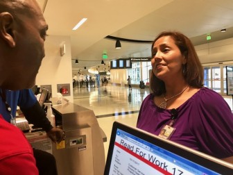 Toni Herrera-Bast, the spokeswoman for the Airport Authority, chats with airport staff.  Herrera-Bast says although the airport is alway happy to chat with other airlines, it is happy with the four carriers it has. 