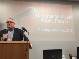 Dr. Joe Ackerson speaks to more than 50 people at Tuesday's public hearing on proposed changes to Medicaid in Alabama.