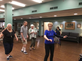 Resident at Episcopal Place are learning how to salsa dance with instructor Jackie Talley.