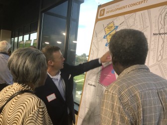 Brian Wolfe of Corporate Realty talks with residents about redevelopment concepts for the former Carraway Hospital.